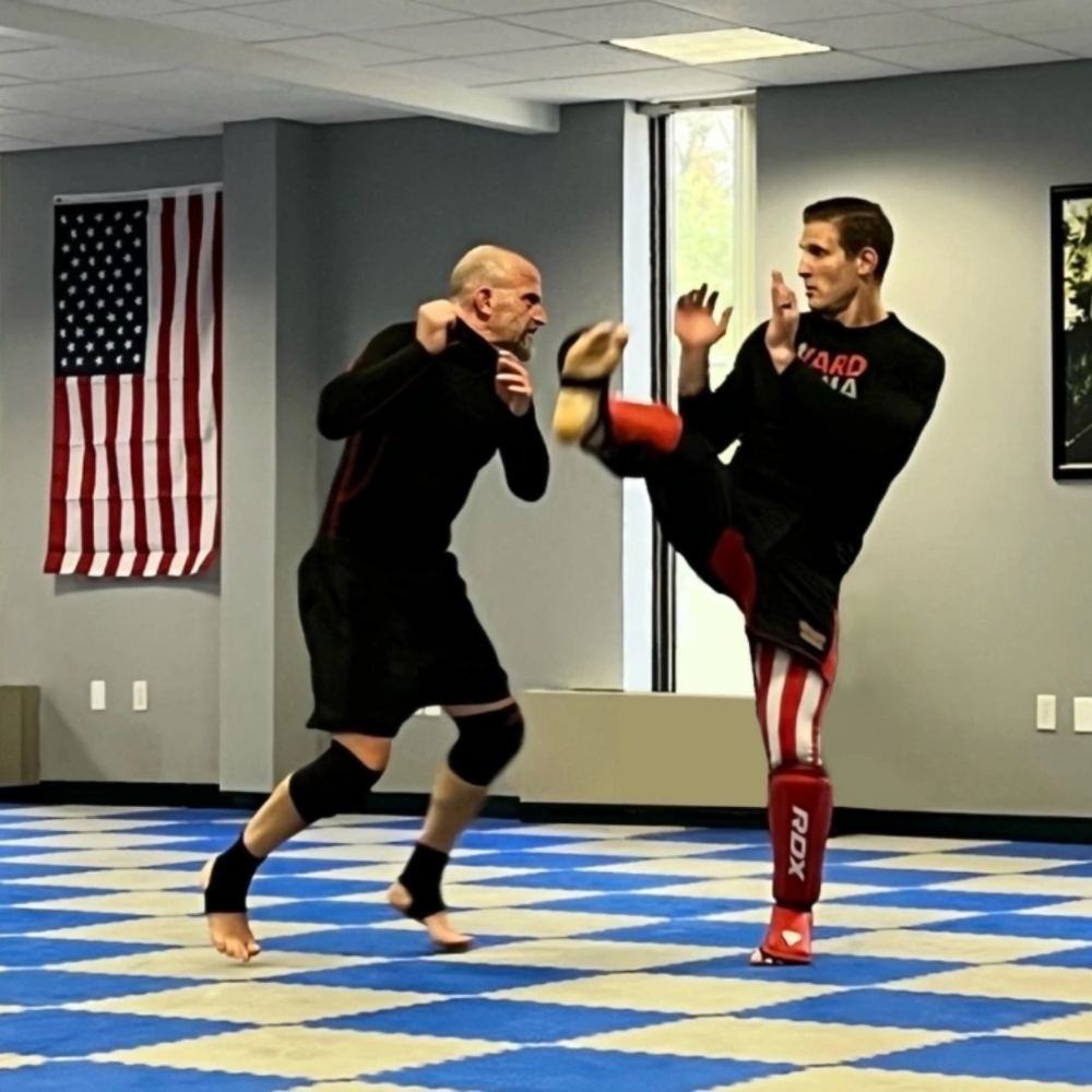 Coach Jay throwing a kick in a training session